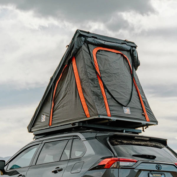 Badass Tents PACKOUT Clamshell Rooftop Tent Action Shot on RAV4 Rear